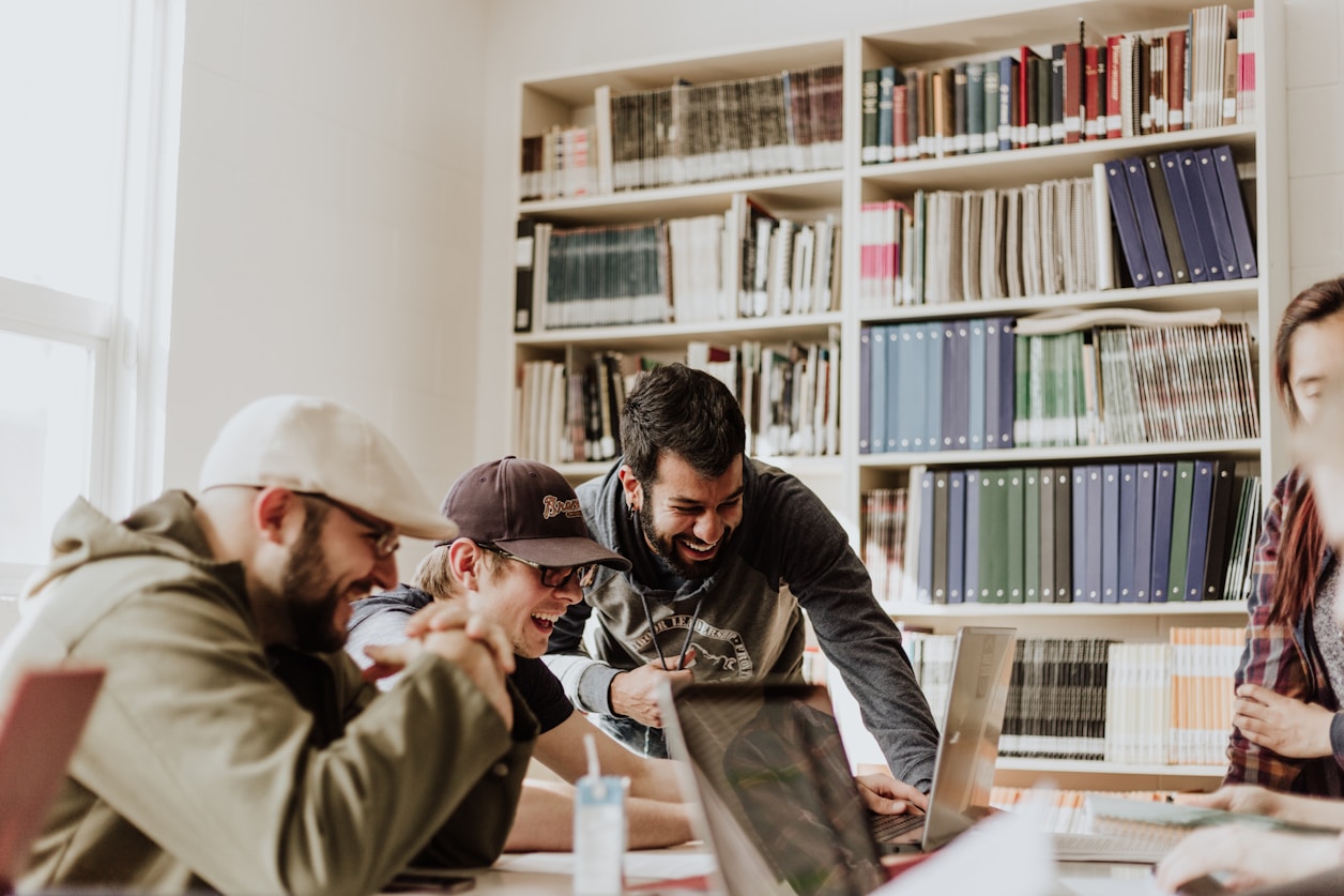 Group gathered around a library table