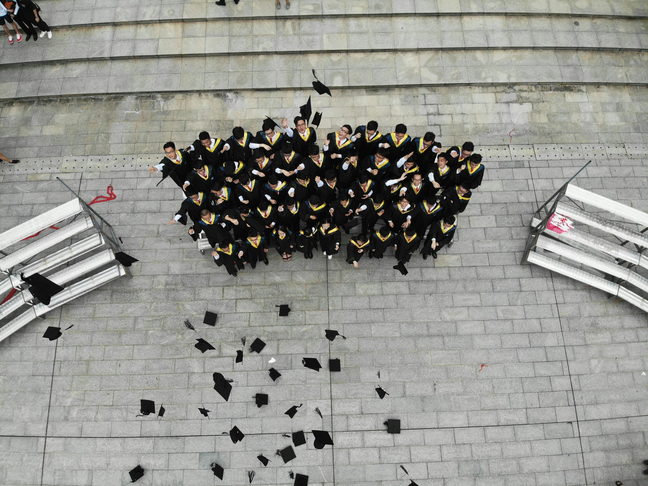 NUS graduates celebrating at commencement