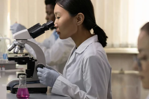 Scientist at a microscope